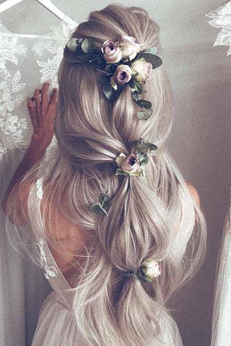 weaving hairstyles with flowers will look more perfect and more individual