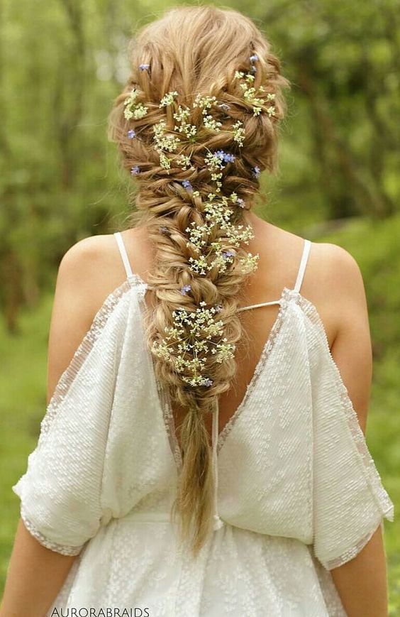 weaving hairstyles with flowers will look more perfect and more individual