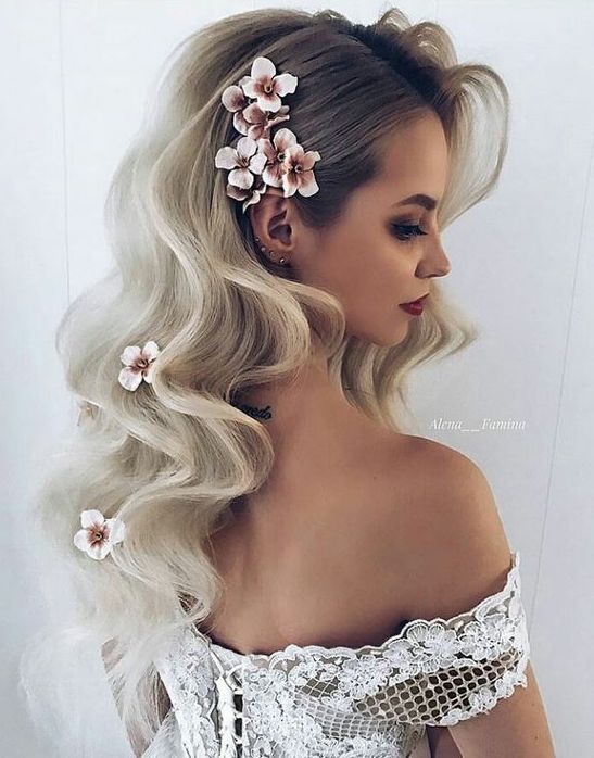 weaving hairstyles with flowers will look more perfect and more individual